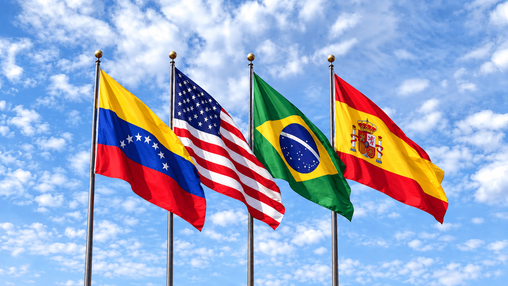 Banderas de Venezuela, Estados Unidos, Brasil y España ondeando juntas